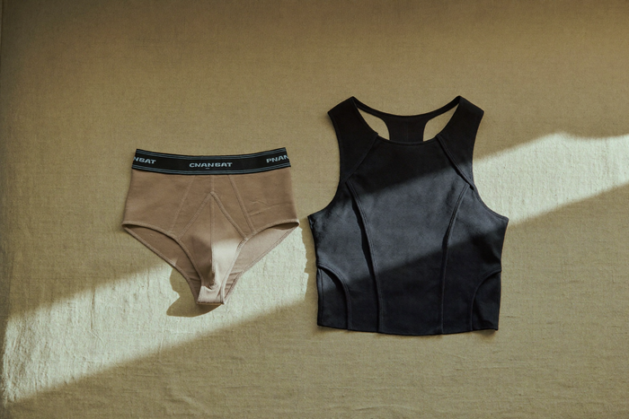 Two folded compression garments side by side, comparison still