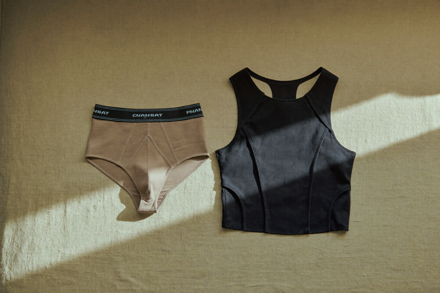 Two folded compression garments side by side, comparison still