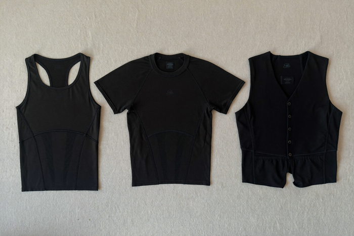 Three undershirts laid out flat — tank, short sleeve, long sleeve