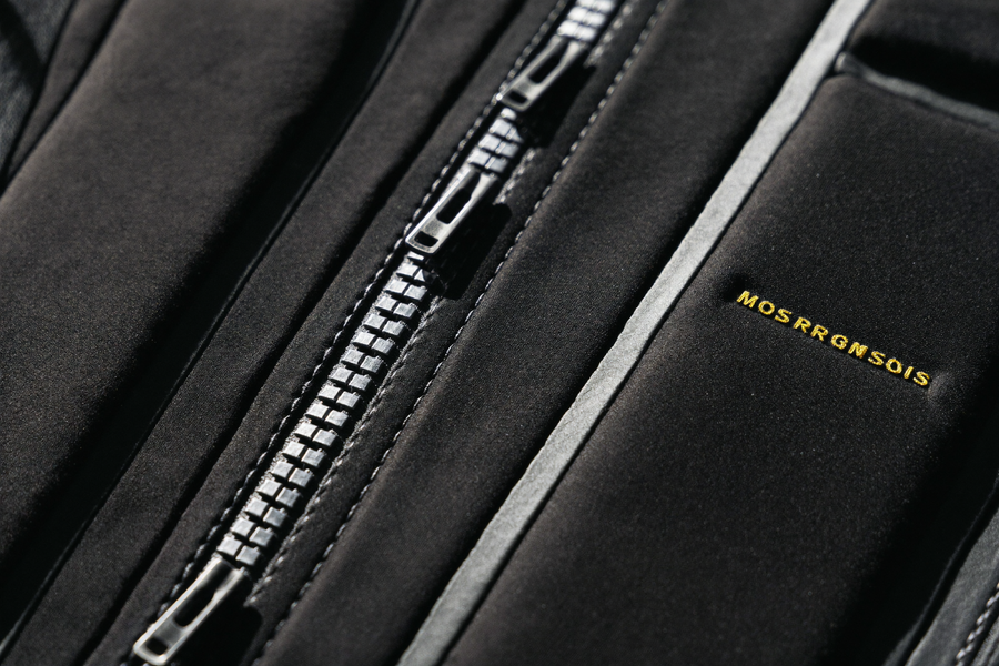 Macro shot of 3-row closure on Support Compression Vest, gold thread