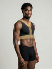 Side profile of the UNDR compression vest in white with gold stitch detail
