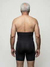 Back view of the UNDR full-leg compression base layer, showing hamstring and calf alignment