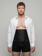 Man wearing a white shirt over the UNDR Core Support Band, nothing visible