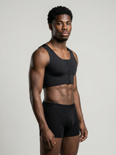 Man wearing the UNDR Lumbar Support Compression Vest in black, front view