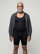 Man layering a grey jacket over the UNDR Extended Lower Compression Layer