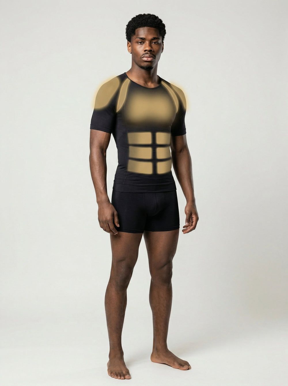 Man wearing a black and gold compression garment on a white background